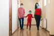 © volurol - Family wearing safety medical masks. Coronavirus epidemic. Health care concept.