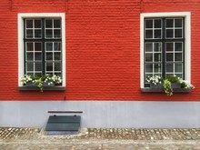 Windows On Red Brick Wall