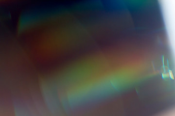 Fototapete - Colourful lens flare on black background.
