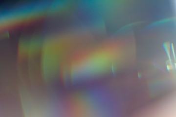 Fototapete - Colourful lens flare on black background.