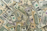 Fototapeta  - Dolary amerykanskie w banknotach porozrzucane na stole