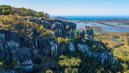 Wall Mural - Aerial view of Pedra Branca - Garopaba. Beautiful rock formation on top of the mountain in Santa Catarina, Brazil