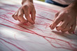 © PHILIPPE DEGROOTE/ADDICTIVE STOCK - Male artisan working with threads in workshop