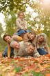 © aletia2011 - Happy smiling family relaxing in autumn park