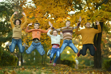 Wall Mural - Happy mother, father and children in park