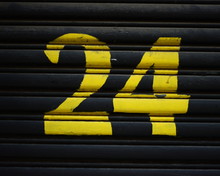 Close-up Of Number 24 On Closed Shutter