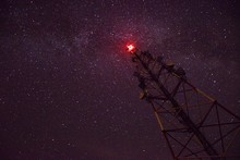 Low Angle View Of Communications Tower Against Sky At Night