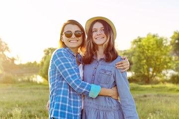 portrait of happy smiling hugging daughter and mother. mothers day