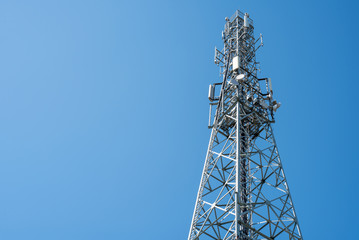 Communication tower with clear blue sky