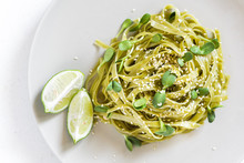 Green Vegan Spinach Pasta With Sunflower Seeds Microgreens, Sesame Seeds And Lime