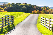 View Of Road Driveway Through Scenic Farm Fields Land And Appalachian Mountains In Bath County, Virginia With Fence And Open Gate