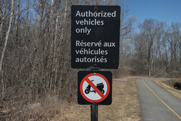 Authorized Vehicles Only roadside bilingual English French nobody