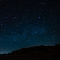 Wall Mural - starry sky on a background of a slope, night landscape. astrology, horoscopes, astro screensaver, sp