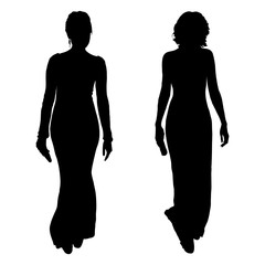 Vector silhouettes of two young women in evening dresses with a clutch bag in hand. Isolated on white background, slender figures of forward-going girls of models.