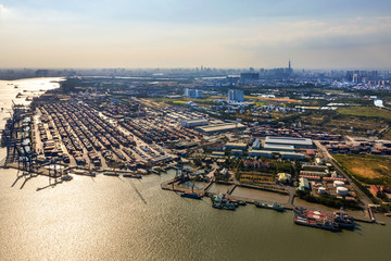 Wall Mural - Top view aerial of Cat Lai container harbor, center Ho Chi Minh City, Vietnam with development buildings, transportation, energy power infrastructure.