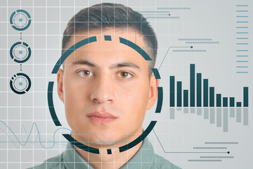 Wall Mural - Young businessman using facial recognition system for data protection