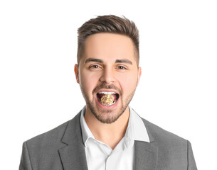 Canvas Print - Handsome young businessman with tasty chocolate candy on white background