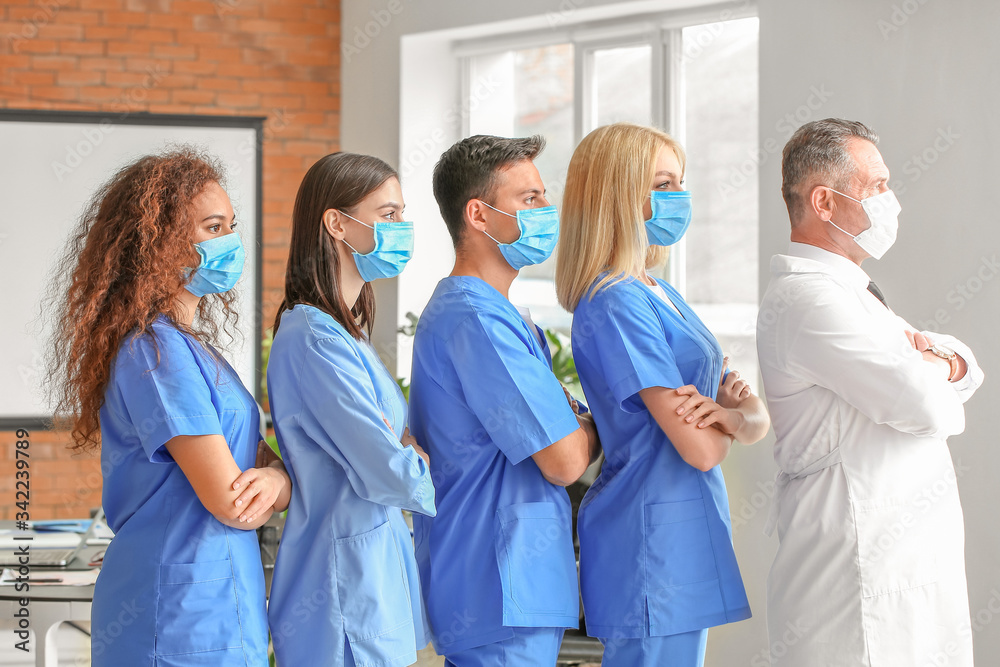 Male lecturer with medical students in university