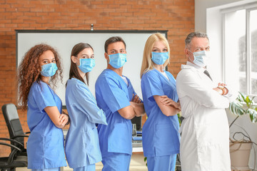 Wall Mural - Male lecturer with medical students in university