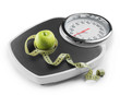 © Pixel-Shot - Weight scales with measuring tape and apple on white background. Slimming concept