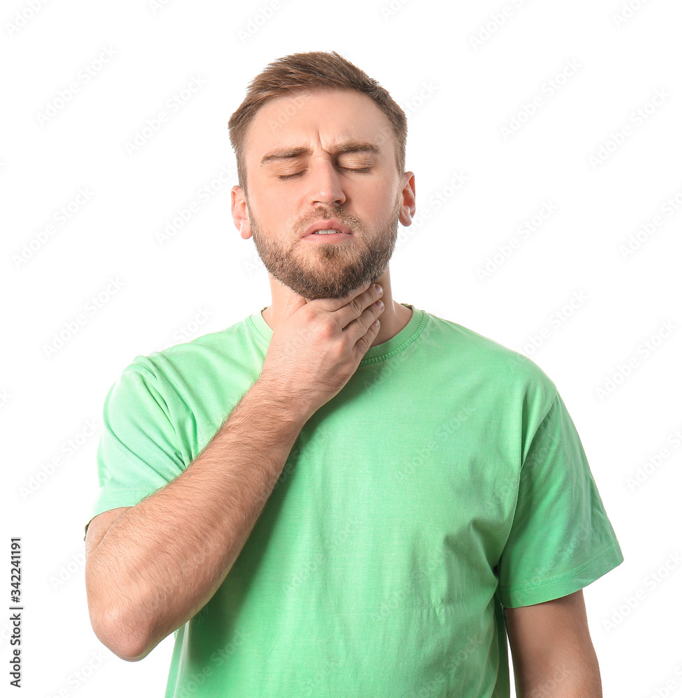 Young man checking thyroid gland on white background