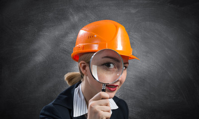 Building inspector looking through magnifier