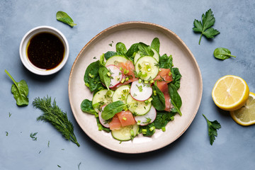 Wall Mural - Salmon salad with spinach, radish, cucumber and green herbs. Clean Eating Concept