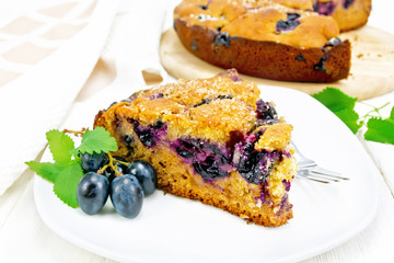 Poster - Pie with black grapes  in plate on board