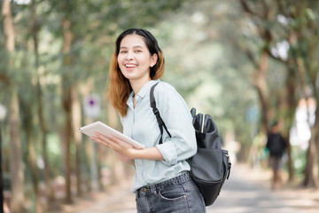 Wall Mural - Happy young Asian University student.