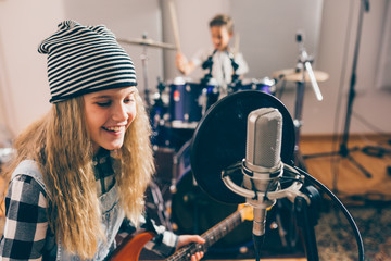 Wall Mural - kids rock band practice in music studio