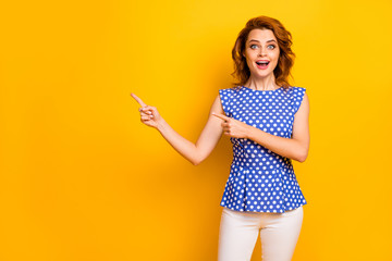 Portrait of her she nice attractive lovely pretty amazed glad cheerful cheery wavy-haired girl showing new novelty gift present isolated on bright vivid shine vibrant yellow color background