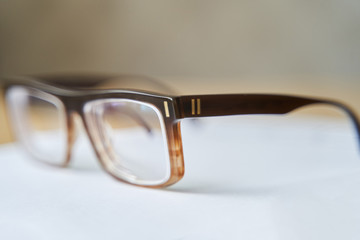 Fashionable brown eyeglass frame. Glasses for myopia. Close-up