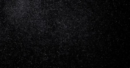 Wall Mural - Natural white winter snowfall on a black background video