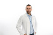 © W PRODUCTION - portrait of handsome man male doctor in hospital with a white lab coat studio shot isolated on white background