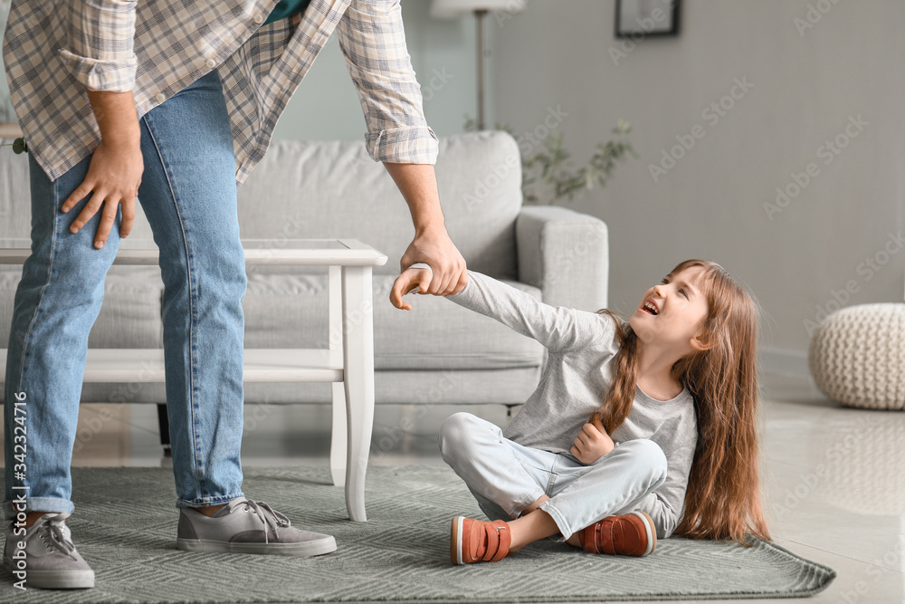 Angry father threatening his daughter at home
