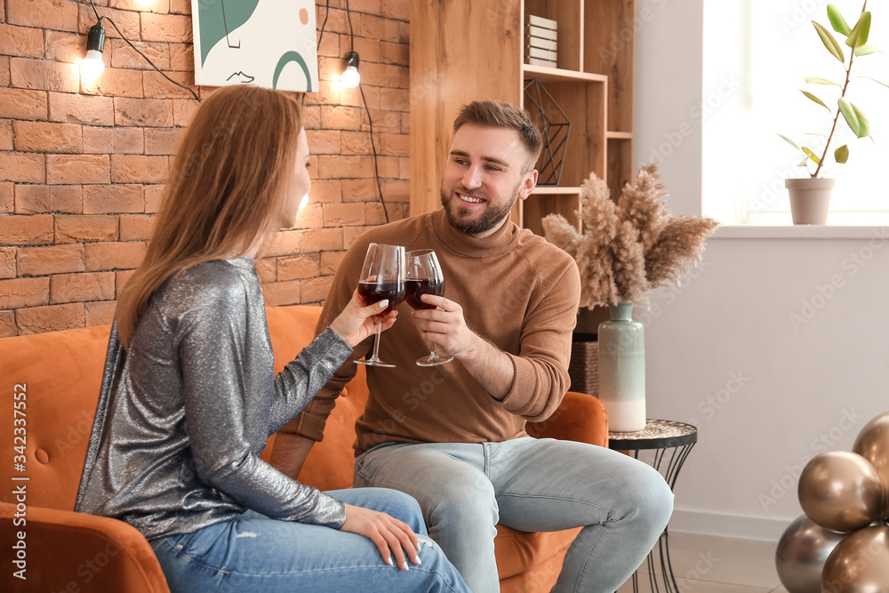 Young couple having party at home