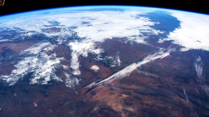 Wall Mural - Earth from space. Time lapse of over the Earth seen from the ISS. Space exploration of planet Earth at night. Elements of this video furnished by NASA.