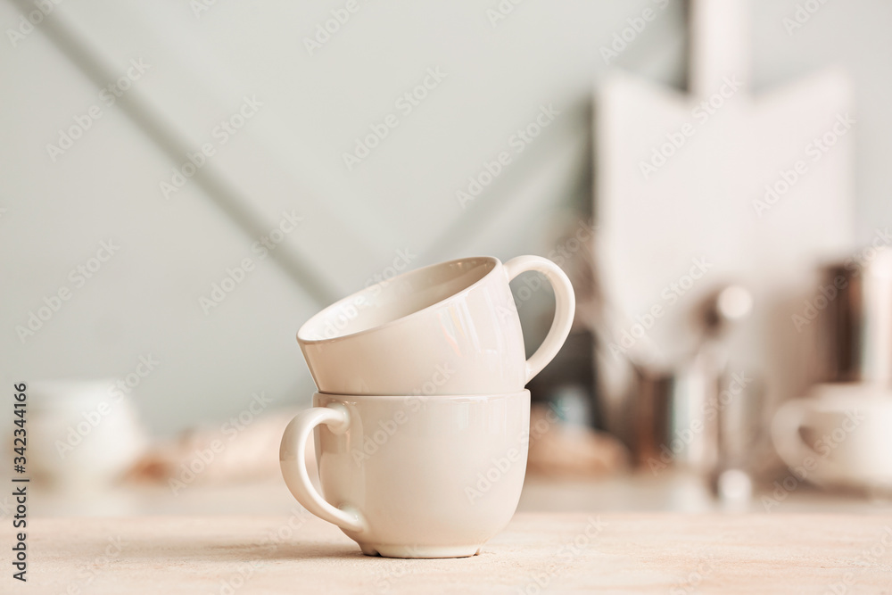 Blank cups on kitchen table