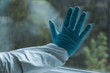 © LIGHTFIELD STUDIOS - cropped view of man in latex glove touching window, quarantine concept