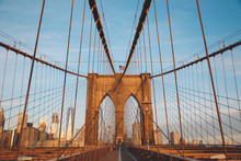 Brooklyn Bridge In City Against Blue Sky