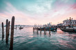 romantic sunset in Venice, gondolas in the water