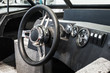 © OlegDoroshin - steering wheel and control panel on a motor boat or yacht
