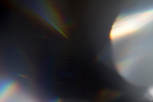 Sun Reflection Over A Piece Of Crystal For A Colorful Lens Flare On Black Background