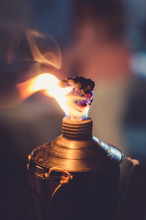 Close-up Of Burning Oil Lamp
