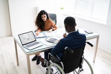 Disabled Businessman Working On Laptop