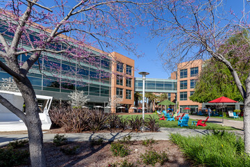 Mountain View, California, USA - March 30, 2018: chair and Building at Google headquarters in Silicon Valley . Google is an American technology company in Internet-related services and products.