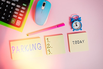 Text sign showing Parking. Business photo text leaving a vehicle in a particular place for a period of time Notepads mouse alarm clock calculator sheet marker colored background