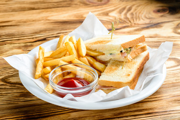 Wall Mural - lunch on a plate sandwich, french fries and ketchup