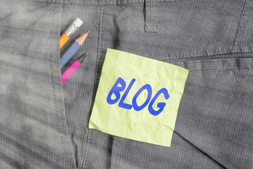 Poster - Conceptual hand writing showing Blog. Concept meaning regularly updated website web page run by individual Writing equipment and green note paper in pocket of trousers