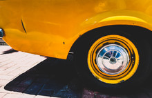 Close-up Of Yellow Vintage Car Tire